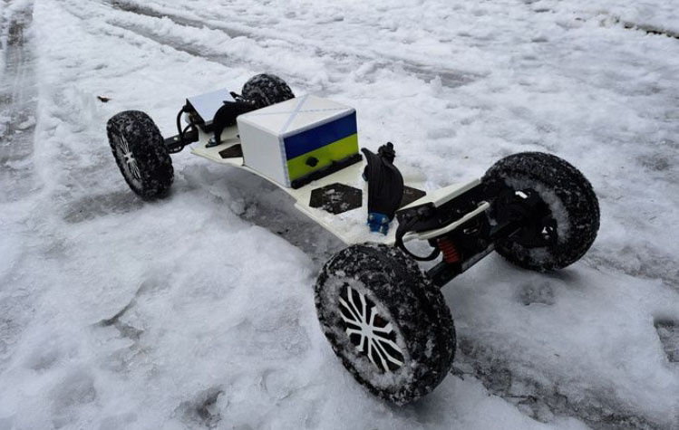 Telum BA electric skateboard on a snow day